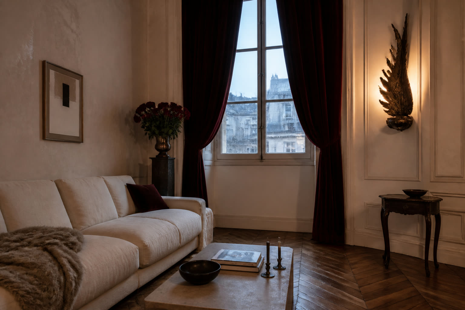 European apartment salon with oxblood velvet curtains, cream linen sofa, dark parquet and warm sculptural lighting