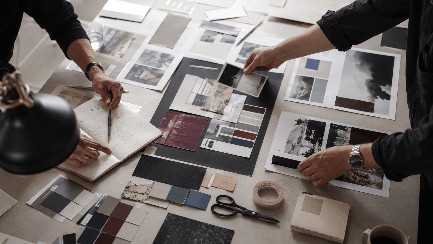 Hands arranging material, colour and image references